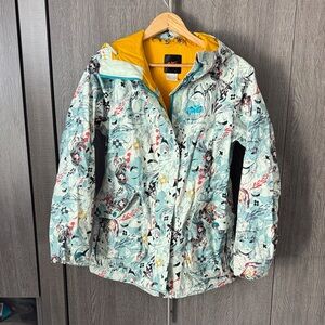 This is a Nike 6.0 women's snowboarding jacket with an anime print design